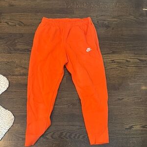 Nike Orange Fleece Joggers with Tapered Legs
